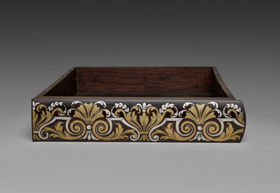 A drawer, alone, out of its cabinet. Dovetails you were never meant to see. The best part of the piece.